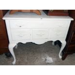 A 36" 20th Century painted mixed wood lowboy with long frieze drawer and three short drawers