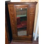 A 3' 7" Victorian pitch pine single wardrobe with moulded cornice and hanging space enclosed by a
