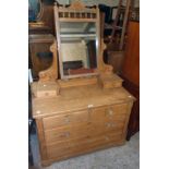 A 3' 5 1/2" late Victorian waxed pine dressing chest with swing mirror, incised supports and