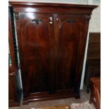 A 4' 9" Victorian flame mahogany veneered multi section linen press with moulded cornice and four