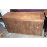 A 4' 8" old waxed pine base with lift-top compartment to sloping top over a pair of tongue and
