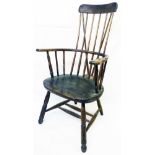 An antique West Country high comb back elbow chair with thick solid elm seat, set on turned front