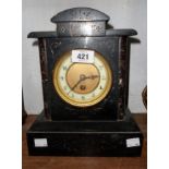 A late Victorian black slate and marble cased mantel timepiece with eight day movement