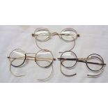 Three pairs of old yellow metal framed spectacles