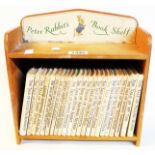 "Peter Rabbit`s Book Shelf" containing twenty three vols. Beatrix Potter 90p. edition titles all