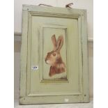 Two painted wood door panels both with central painted hare decoration