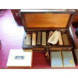 A Tunbridge ware playing card box (a/f) containing seven decks and two whist markers - sold with