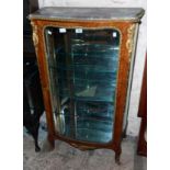 A 29" 20th Century ornate kingwood and gilt metal mounted serpentine front vitrine, with shaped