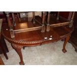 A Victorian mahogany D-end extending dining table with single leaf and winder, set on acanthus