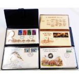 Four plastic wallets containing three coin set commemorative FDC's comprising 25th Anniversary of