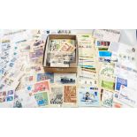 A box containing a collection of PHQ cards, a small collection of loose FDC's and mint decimal GB