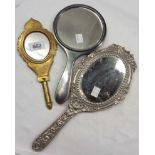 A cast brass hand mirror, a marked 925 mounted hand mirror and another