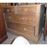 A 3' 7" 19th Century waxed pine chest of two short and two long graduated drawers, set on bun feet -