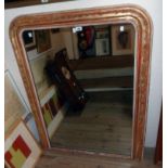 An antique gilt framed dome-top mirror with decorative border and mercury plate - 3' 2" X 4' high