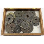A box containing twenty-three antique Chinese coins
