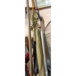 A canvas rod bag containing a Sportex fibreglass two section boat rod No.3045, a Craddock & Co.