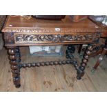 A 35 1/2" Victorian carved oak side table with lion mask to frieze drawer, set on a bobbin turned