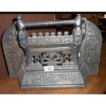 A cast iron bedroom fire front with floral decoration