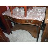 A 36" late 19th Century mahogany serpentine front washstand with shaped marble top, long frieze