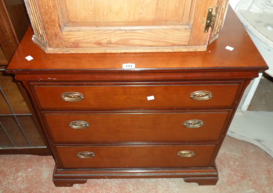 A 32" Stag mahogany effect three drawer chest, set on bracket feet
