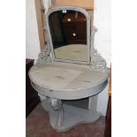 A 3' 3" painted wood demi-lune console dressing table with arched plate, flanking pierced foliate