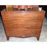 A 36" 19th Century mahogany chest of three long graduated drawers, set on raised bracket feet