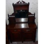 A 3' 11" Edwardian walnut sideboard with bevelled mirror set raised back and flanking shelves over