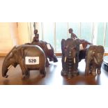 Five carved wood elephant figures including two with riders
