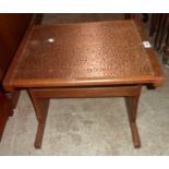 A 21" vintage teak copper topped tea table