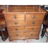 A 3' 8" Victorian pitch pine chest of two short and three long graduated drawers, set on bracket