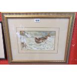 A gilt framed watercolour, depicting figures landing a rowing boat from choppy seas