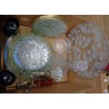 A box containing glassware including decanter, candlesticks, plates, etc.