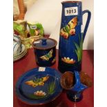 Four pieces of Royal Torquay Pottery including jug, preserve pot, etc.