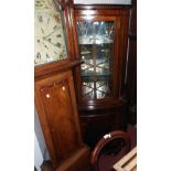 A 27" reproduction mahogany corner cabinet with glazed and mirrored top section over a cupboard