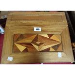 An Eastern hardwood writing slope with marquetry decoration