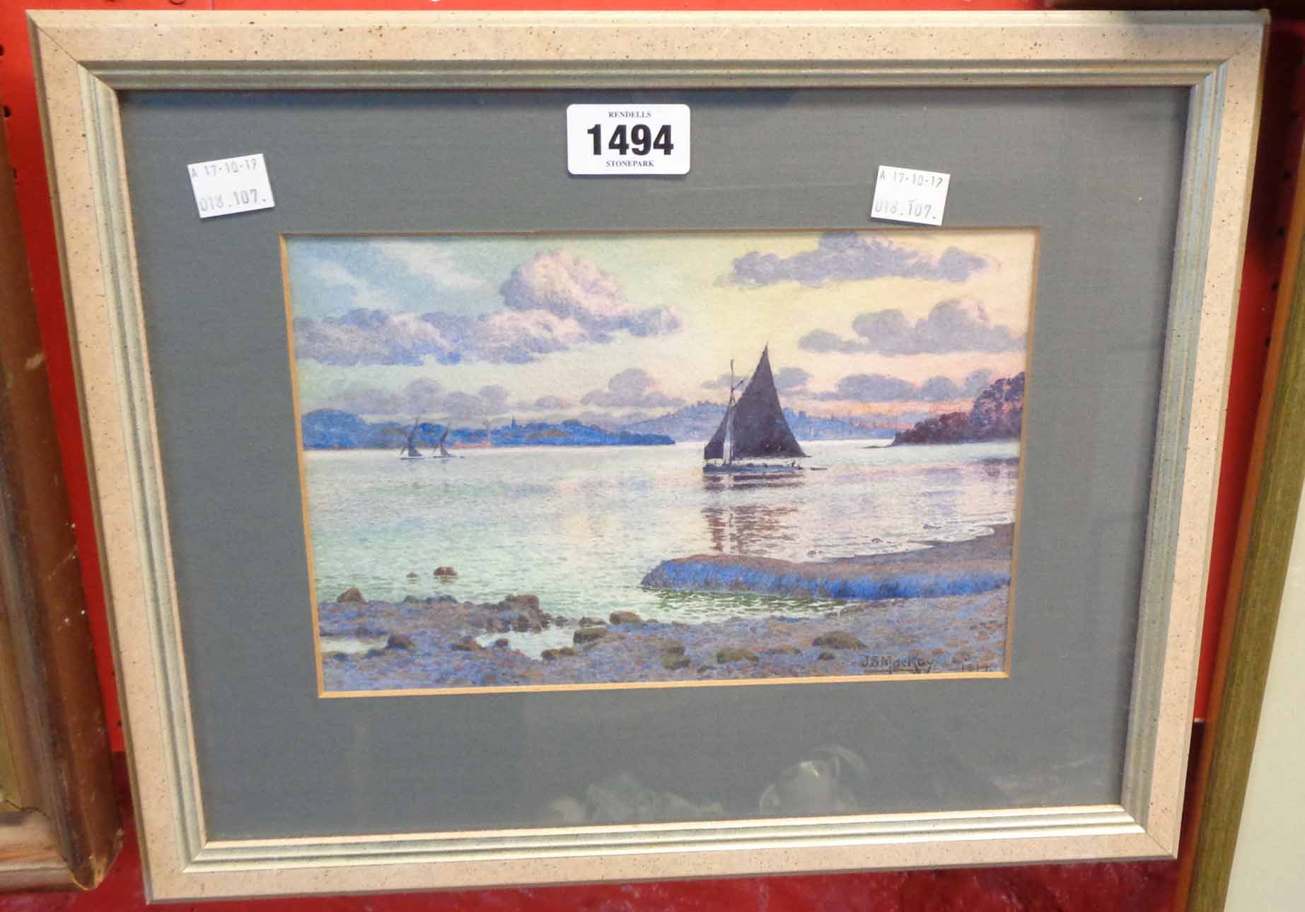 J. S. MacKay: a framed watercolour, depicting a scene with sailing vessels on an estuary at dusk -