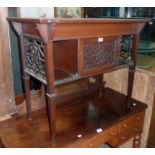 A 36" early 20th Century walnut fretwork decorated side table with central cupboard, bracketed top
