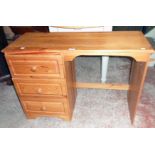 A 3' 4" modern polished pine faced single pedestal knee-hole dressing table with three drawers