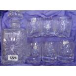 A cut glass decanter and six tumblers