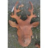 A cast iron garden stag's head with rusted finish