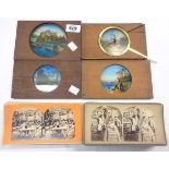 Four antique magic lantern slides including Netley Abbey and a mechanical example depicting a