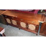 A 6' 8" modern Oriental hardwood faced dresser base with typical moulded decoration to ends of
