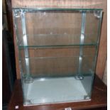An 18" vintage table-top display cabinet with two glass shelves and white glass base - sliding doors