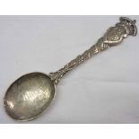 A silver 1911 Coronation spoon with thistle, rose and shamrock and Tria Juncta in Uno text to bowl -