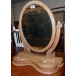 A Victorian stripped wood platform dressing table mirror with oval plate and flanking lift-top