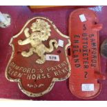 A cast iron tractor seat plaque for Bamford's Patent Lion Horse Rake and a cast iron Bamford's