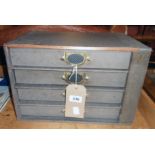 A 15 1/2" vintage Advance (The Library Cabinet) with grey paper covering and four bracket locking