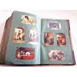 An album (folio size) containing an extensive collection of postcards including Gallery Series, Fine