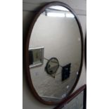 A retro teak framed oval wall mirror - sold with a modern polished wood desk tidy
