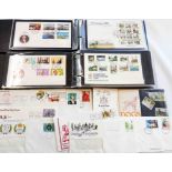 Two ring bound albums containing a collection of mainly late 20th Century Guernsey FDC's, some